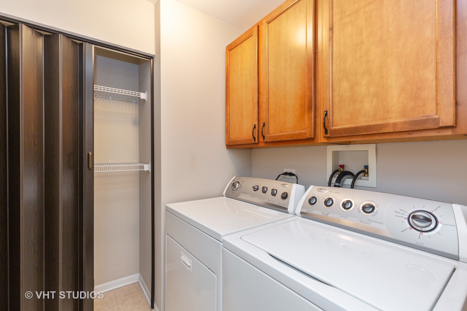 973 Oak Ridge Boulevard, Unit 973 Elgin, IL 60120 - Photo 14 of 18 a utility room with dryer and washer