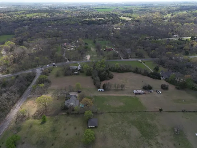 an aerial view of a house with outdoor space