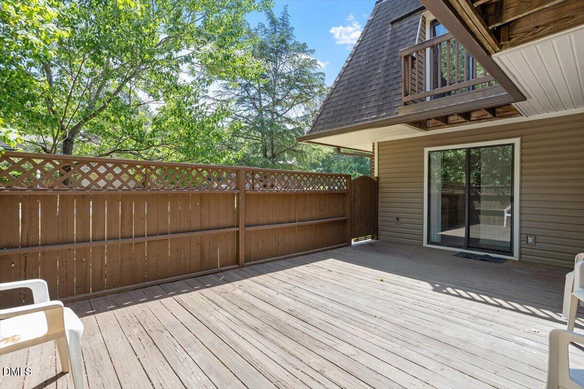 163 Springberry Lane Chapel Hill, NC 27517 - Photo 32 of 32 a view of backyard with wooden fence and large trees