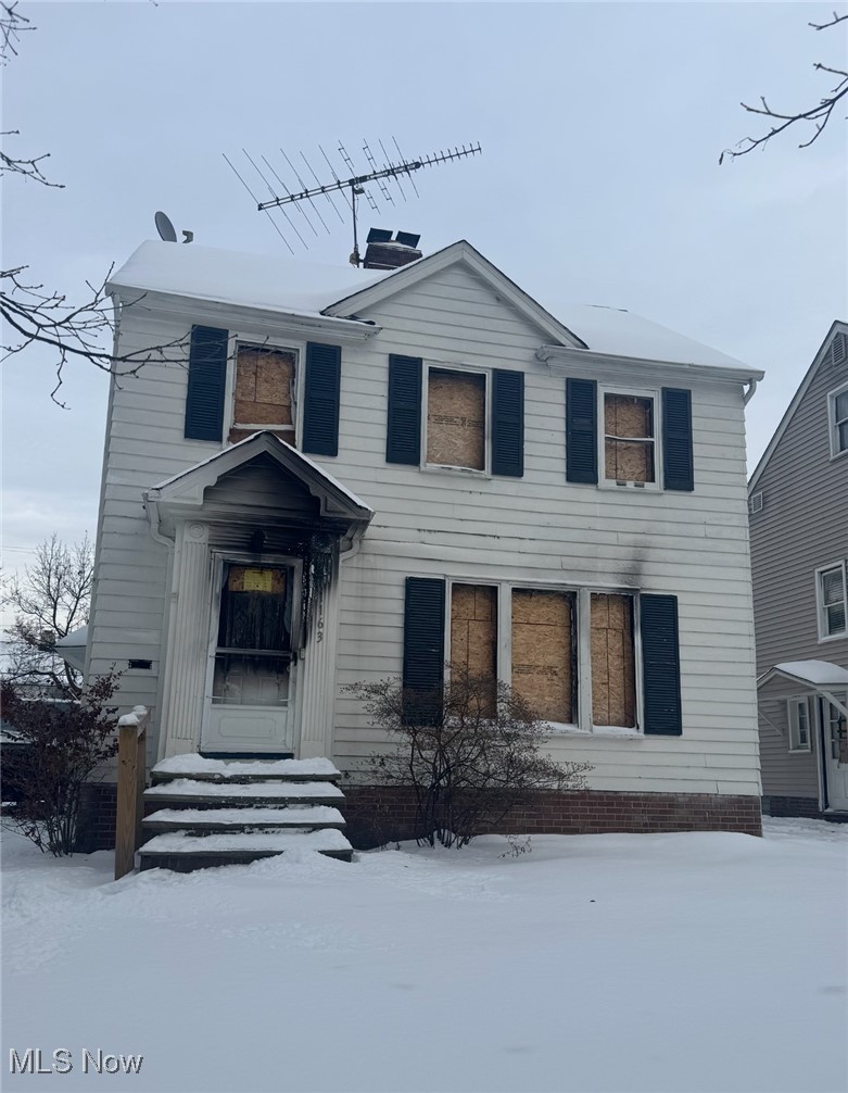 1163 Pennfield Road Cleveland, OH 44121 - Photo 1 of 1 View of front facade featuring a chimney and entry steps