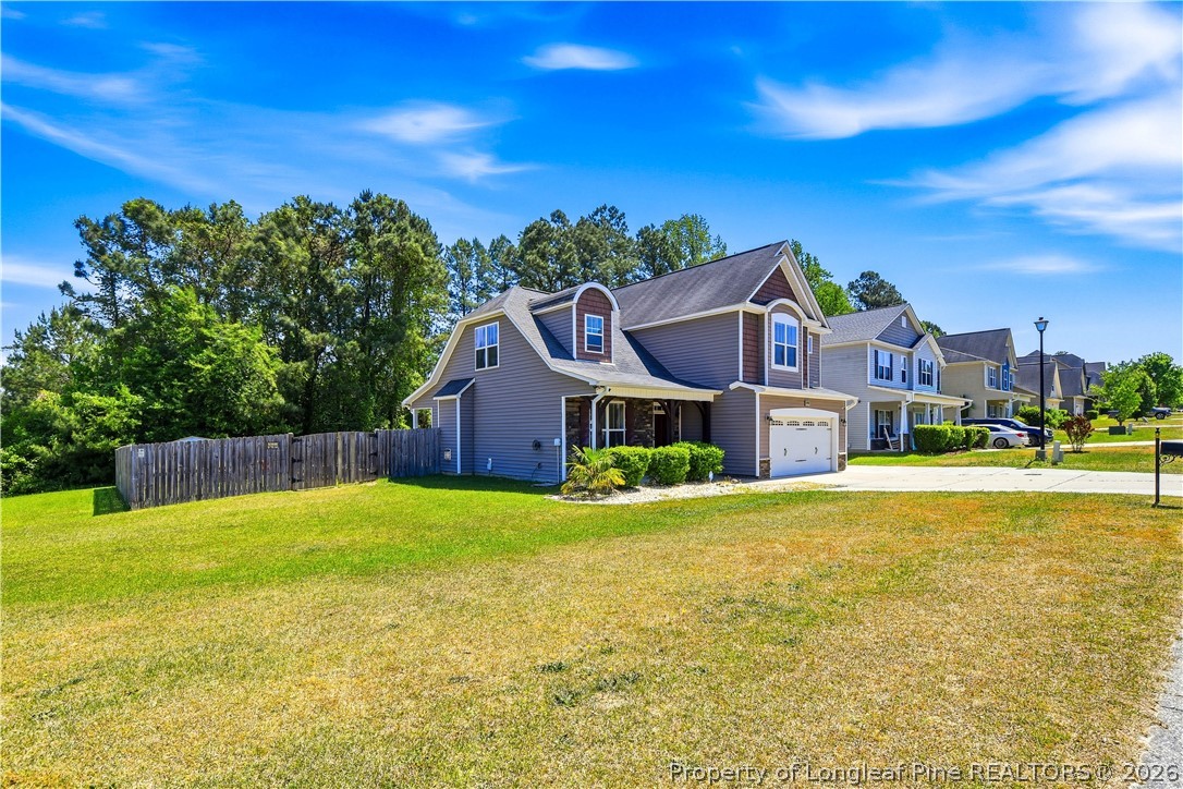 140 Birch Avenue Spring Lake, NC 28390 - Photo 4 of 49 a house with a yard in front of it