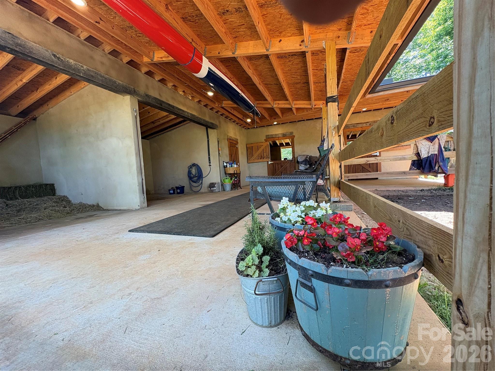 250 Burt Blackwell Road Mill Spring, NC 28756 - Photo 24 of 47 a view of a porch with a potted plant