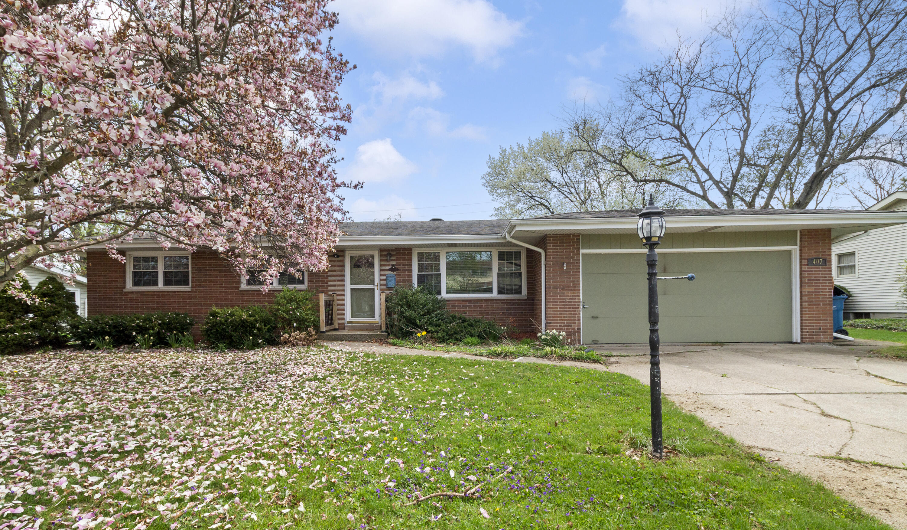407 East Elizabeth Drive Crown Point, IN 46307 - Photo 1 of 24 a view of a house with a yard