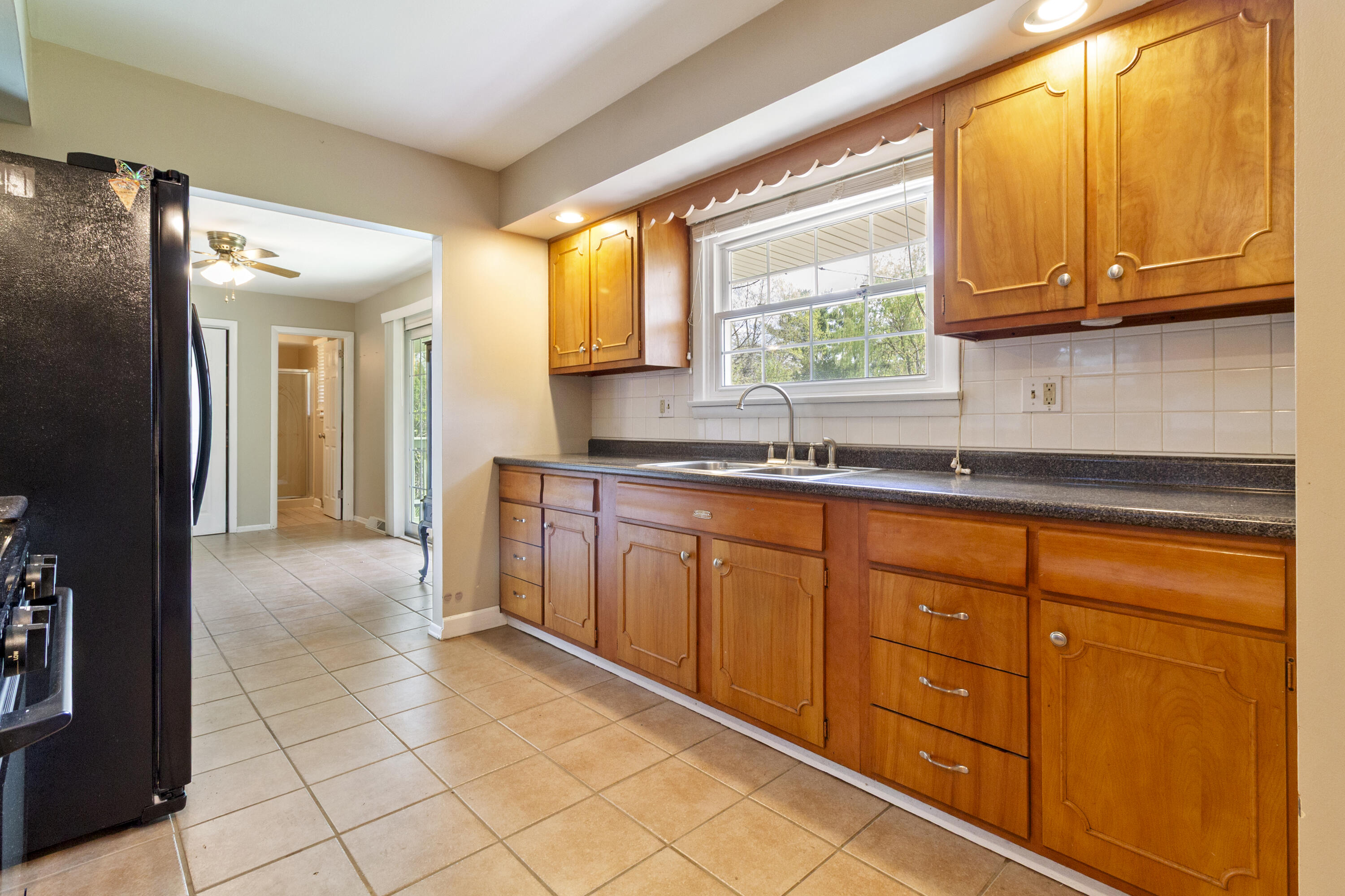 407 East Elizabeth Drive Crown Point, IN 46307 - Photo 6 of 24 a kitchen with stainless steel appliances granite countertop a refrigerator and a sink