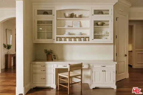 a kitchen with a cabinets and chairs