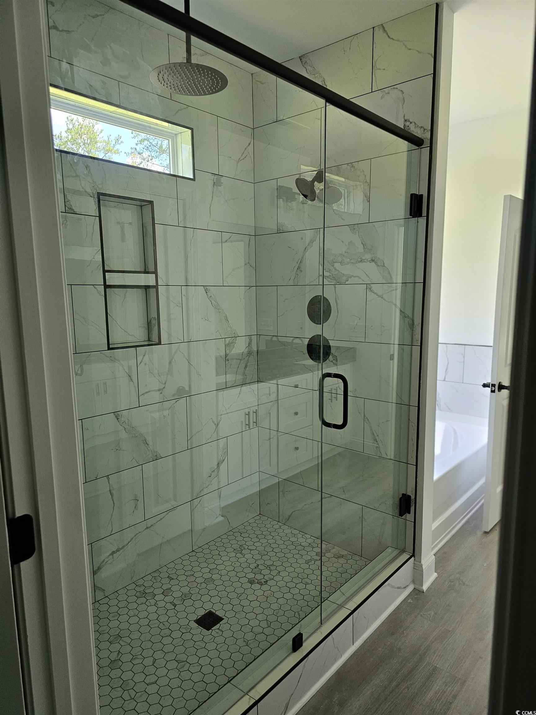 3808 Kelly Road Conway, SC 29526 - Photo 16 of 21 Bathroom with separate shower and tub and hardwood