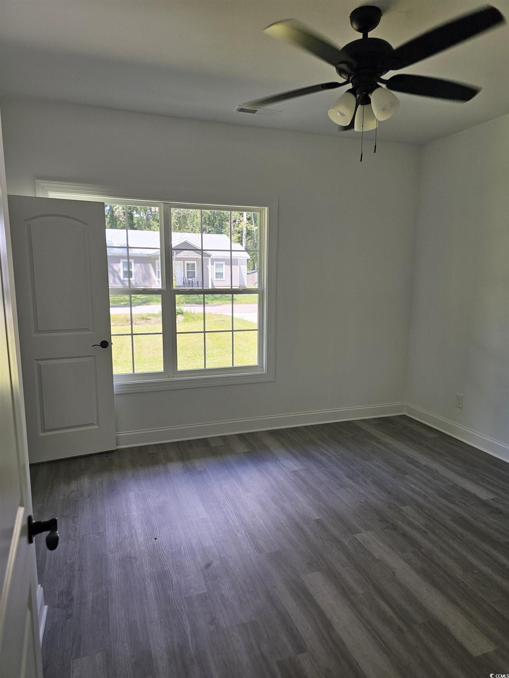 3808 Kelly Road Conway, SC 29526 - Photo 21 of 21 Empty room featuring dark hardwood / wood-style fl