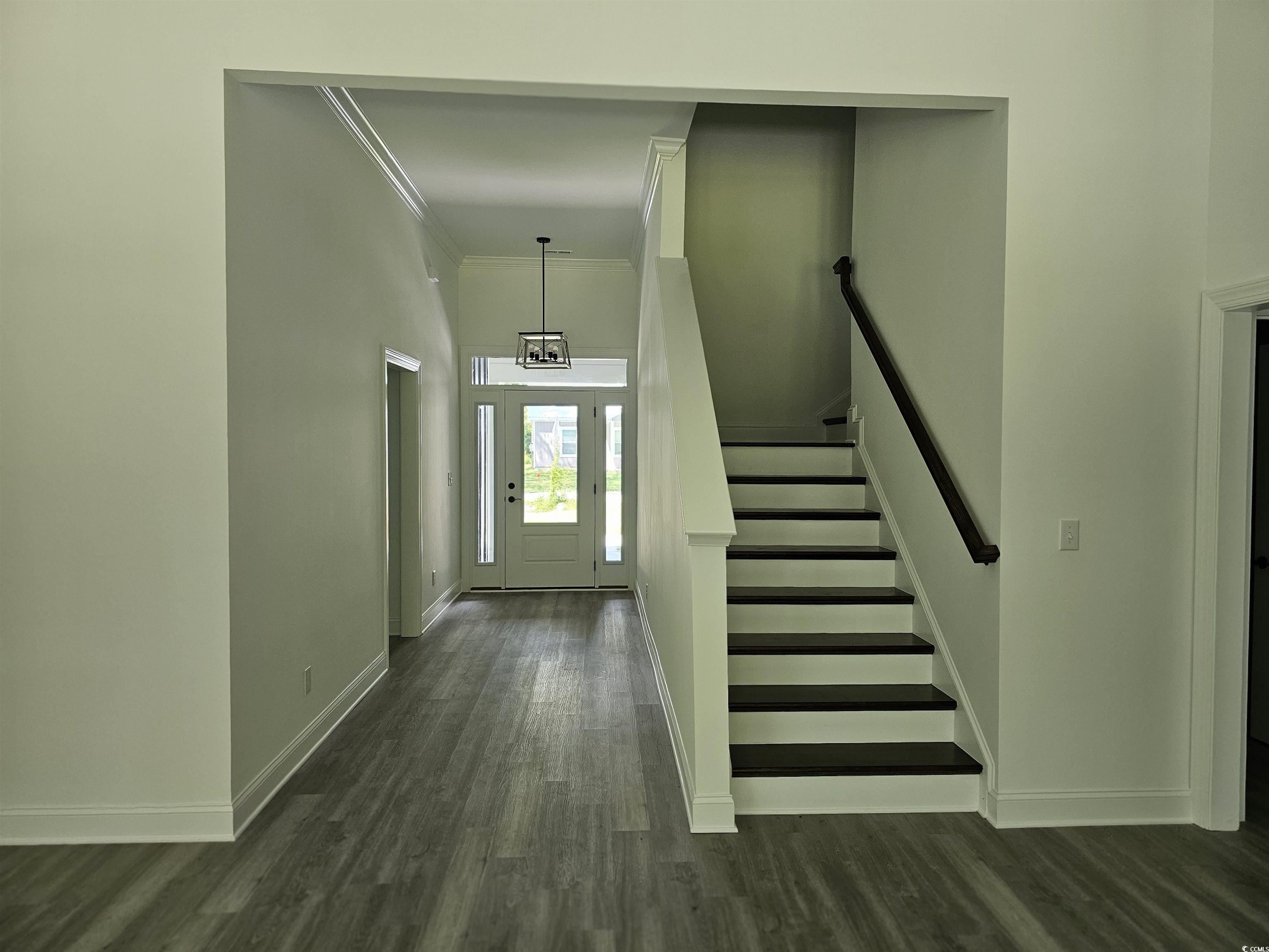 3808 Kelly Road Conway, SC 29526 - Photo 10 of 21 Stairs featuring ornamental molding and hardwood /