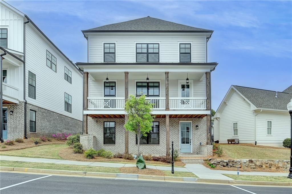 717 Farmstead Road Suwanee, GA 30024 - Photo 1 of 1 a front view of a house with garden