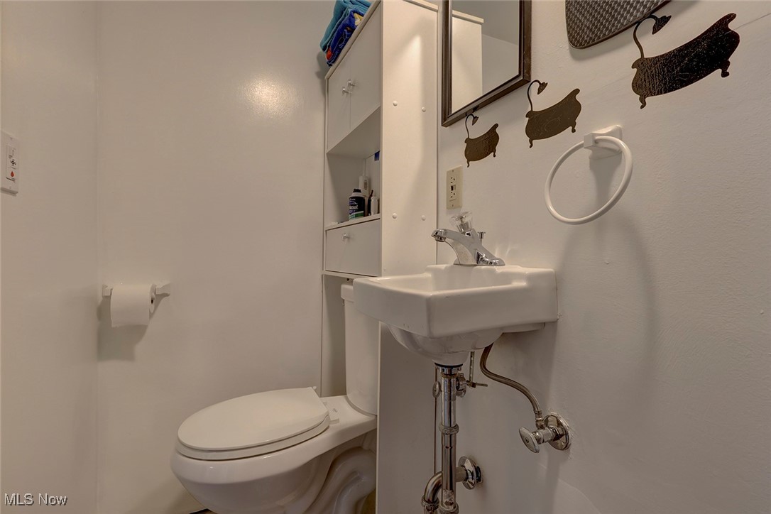 1525 Root Road Lorain, OH 44052 - Photo 28 of 41 Lower level bathroom with toilet and sink