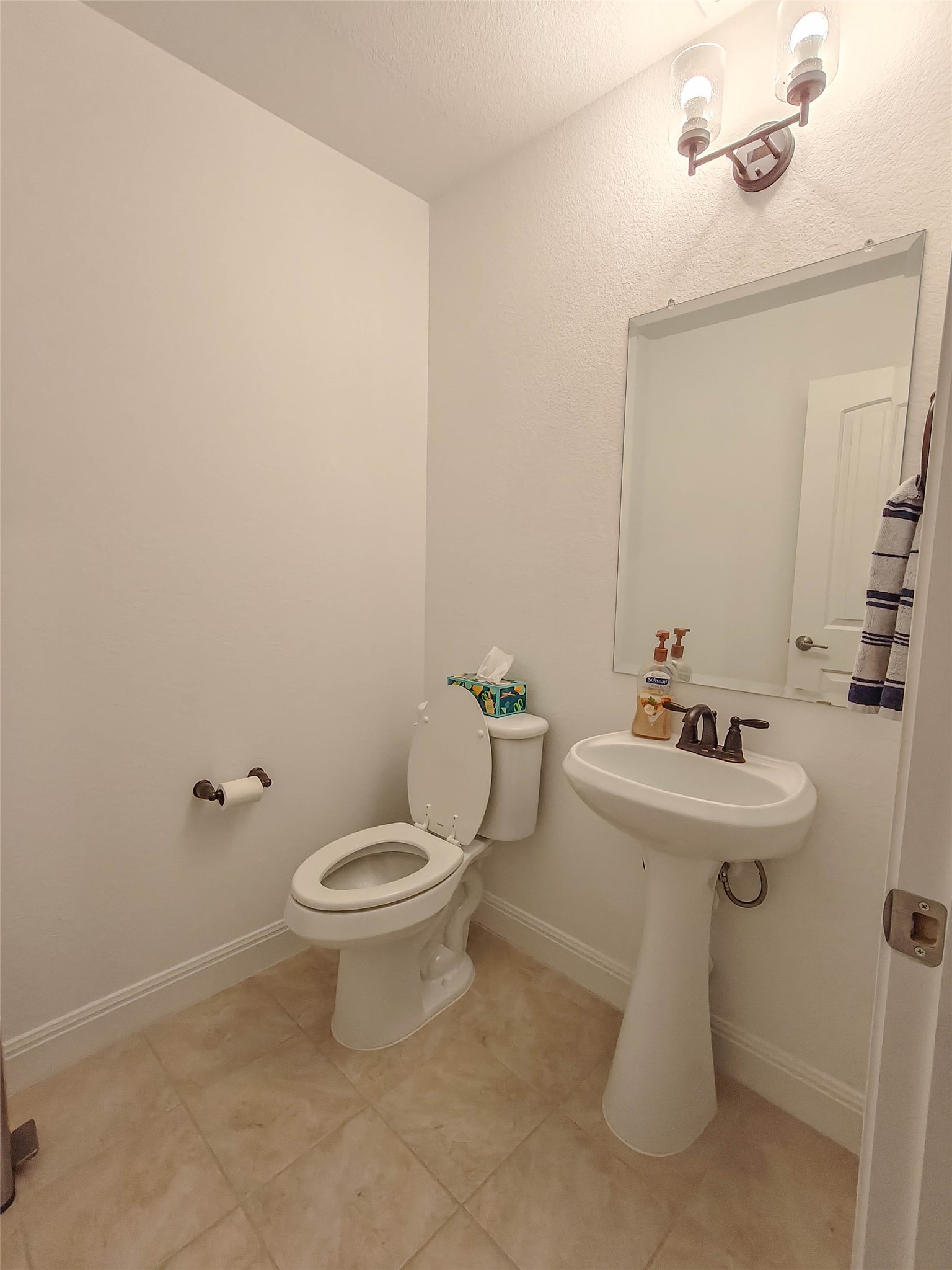 200 Fiddleneck Road Marble Falls, TX 78654 - Photo 22 of 37 a white toilet sitting next to a bathroom sink