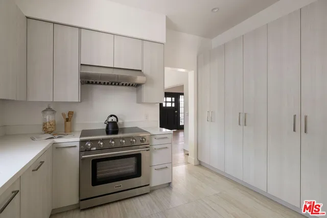 a view of a dining room with furniture and a potted plant