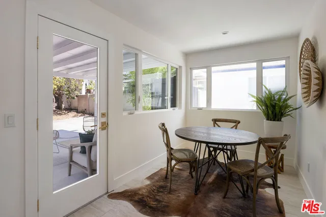 a view of a livingroom with furniture and front door