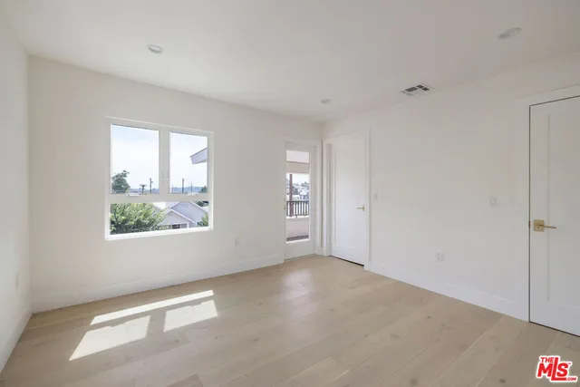 a bathroom with a bathtub shower sink and mirror