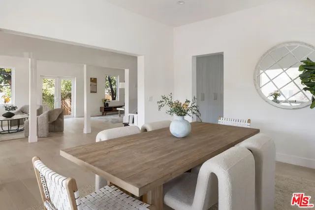 a kitchen with stainless steel appliances a sink stove and cabinets
