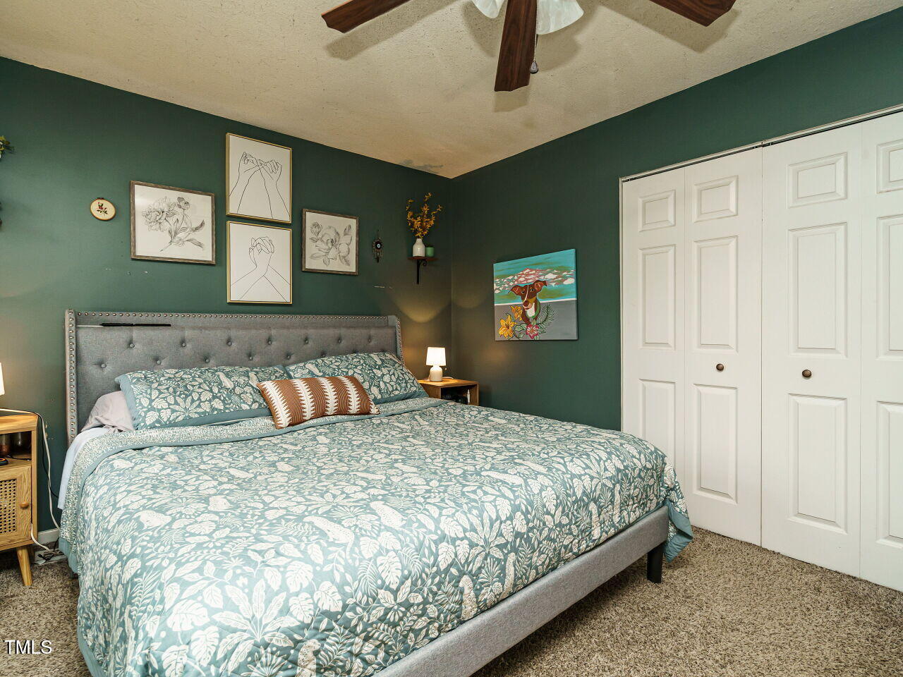 713 Godwin Court Raleigh, NC 27606 - Photo 20 of 29 a bedroom with a large bed and a chandelier
