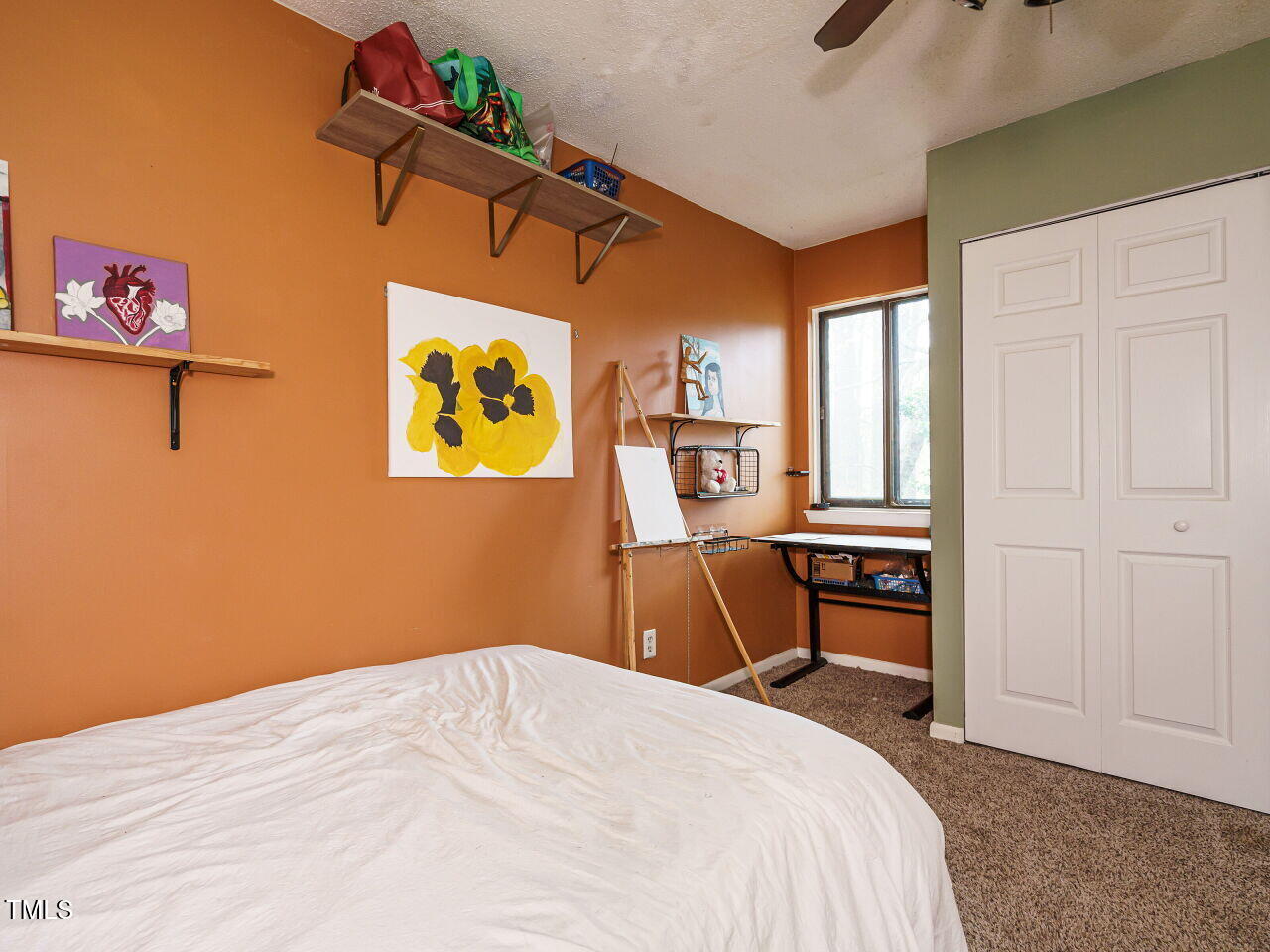 713 Godwin Court Raleigh, NC 27606 - Photo 23 of 29 a bedroom with a bed and a desk