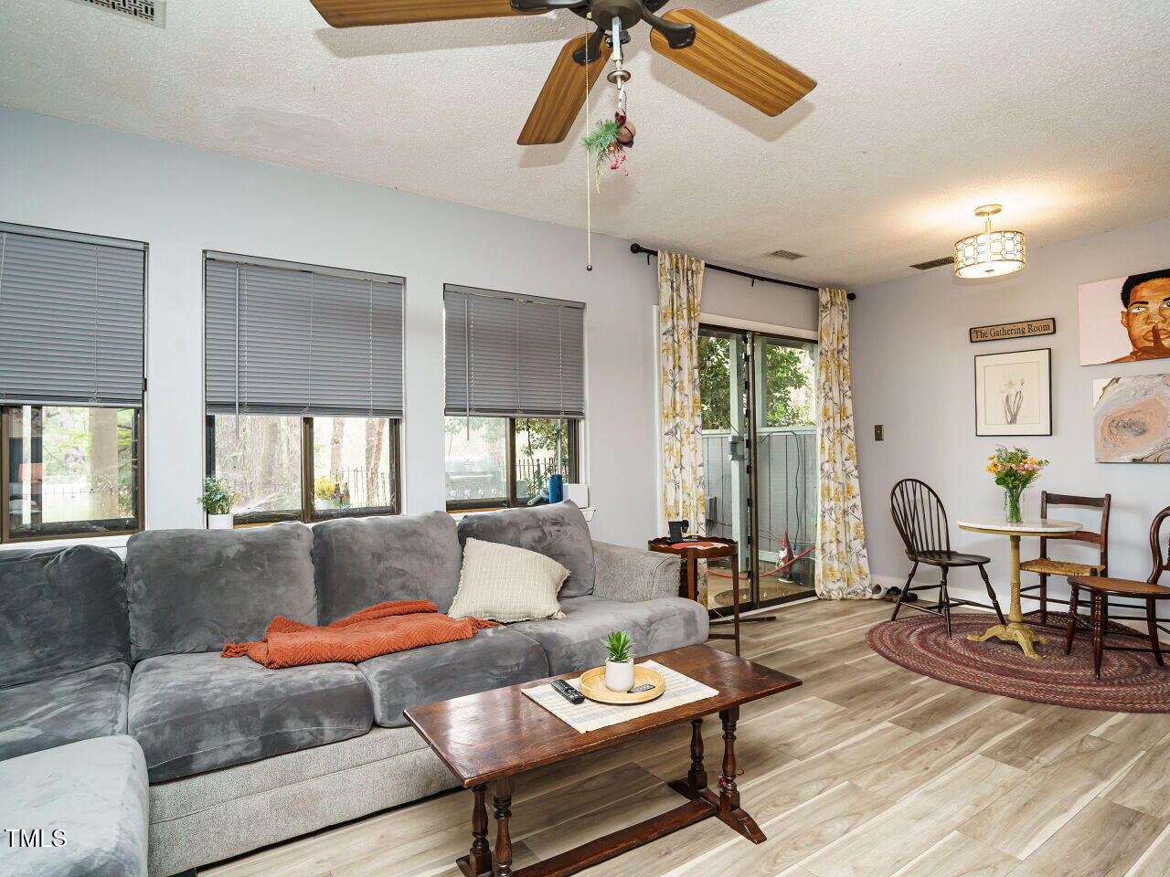 713 Godwin Court Raleigh, NC 27606 - Photo 5 of 29 a living room with furniture and wooden floor