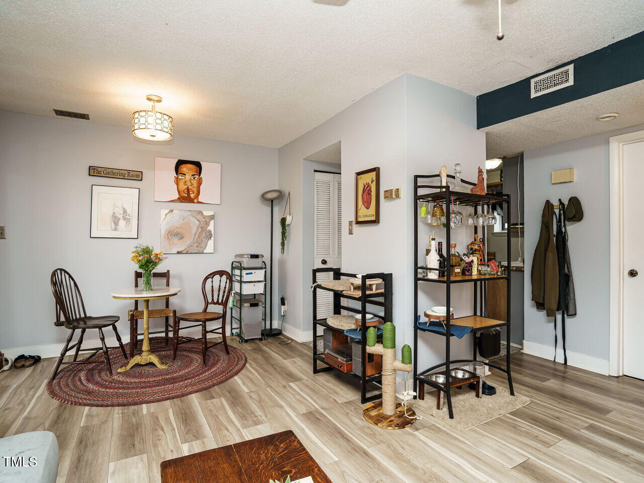 713 Godwin Court Raleigh, NC 27606 - Photo 6 of 29 a view of a livingroom with furniture and gym equipment