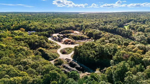 an aerial view of residential building with outdoor space