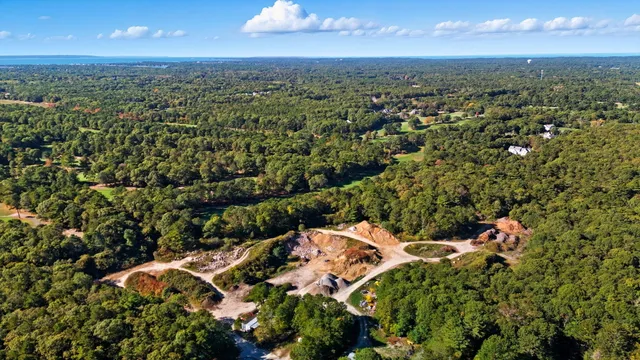 an aerial view of a houses with a yard