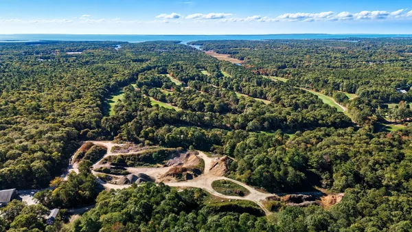 an aerial view of residential house with outdoor space