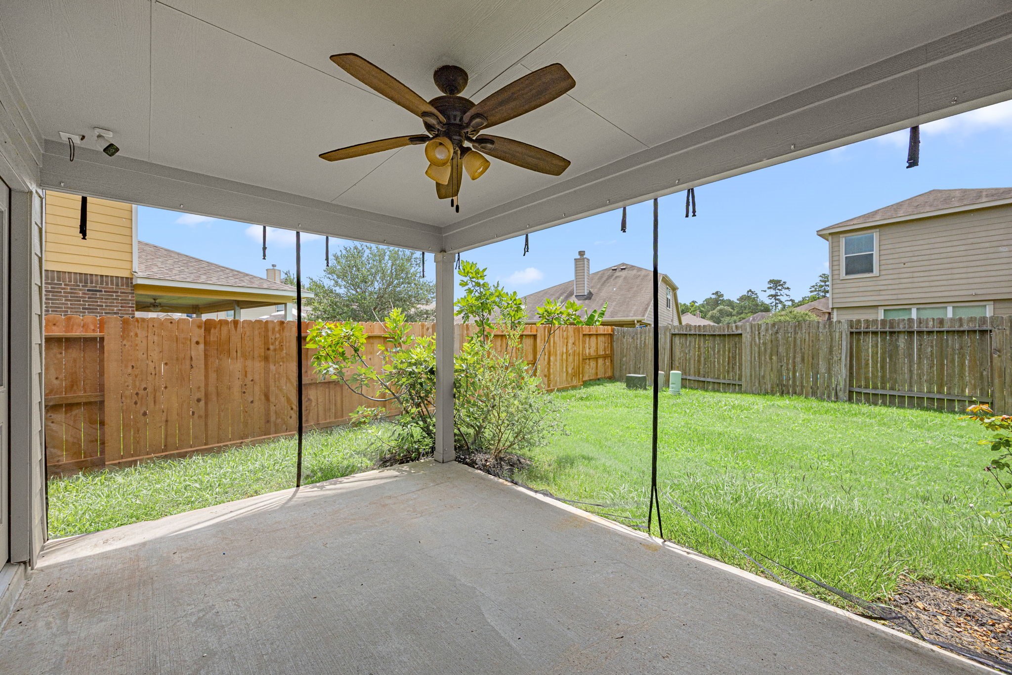2211 Oak Rise Drive Conroe, TX 77304 - Photo 5 of 29 Covered patio overlooking spacious backyard