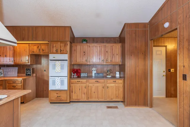 a kitchen with cabinets and window