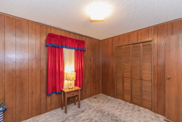 a view of a room with a window and a bathroom