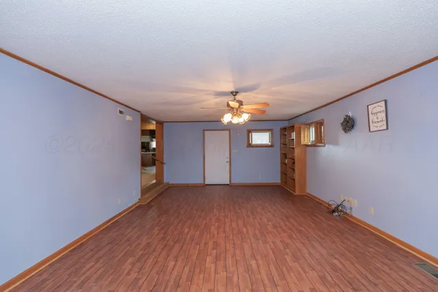 a view of livingroom with hardwood floor and hallway