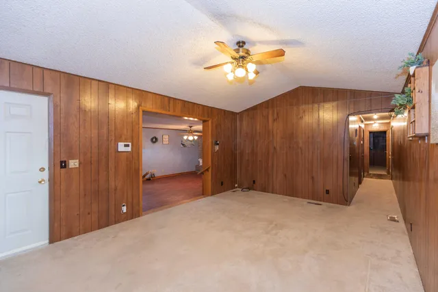 a view of an empty room with a bathroom