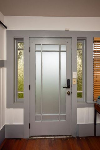 a living room with furniture flowerpot and window