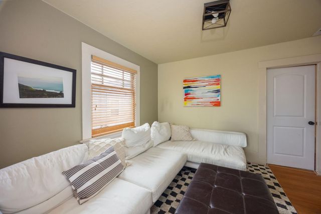 a white toilet sitting next to a window