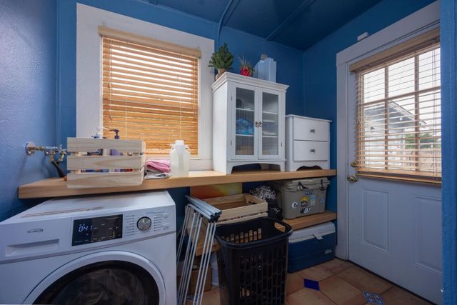 an aerial view of residential house with outdoor space and swimming pool