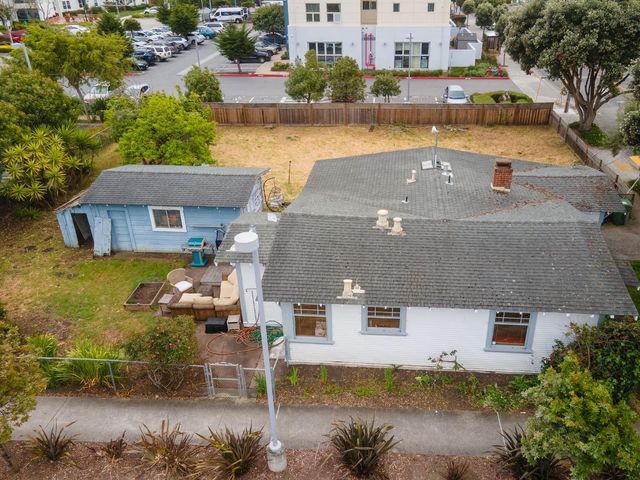 an aerial view of a house with a lake view