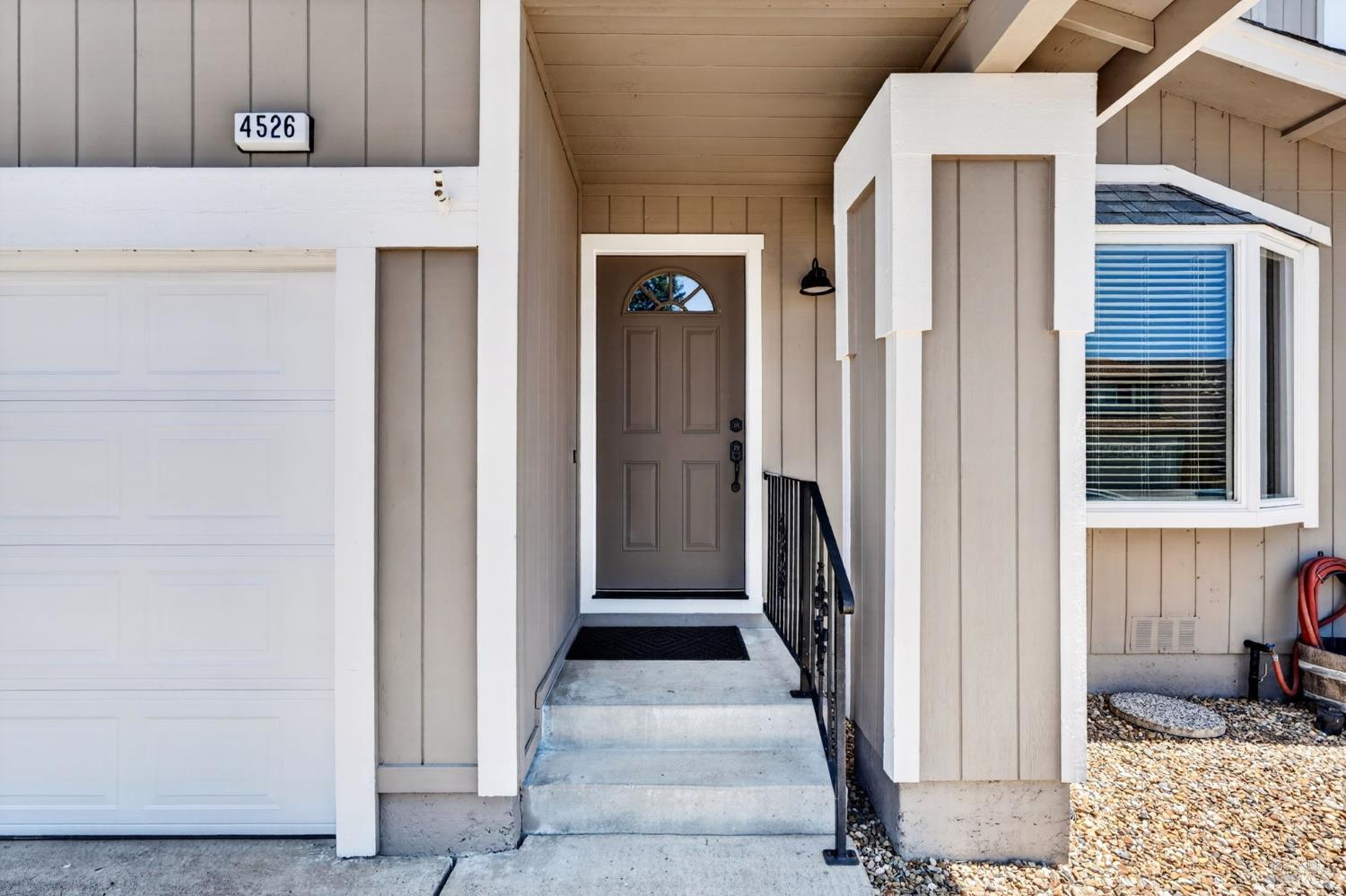 4526 Hillview Court Rohnert Park, CA 94928 - Photo 2 of 28 a view of a hallway with wooden walls and staircase
