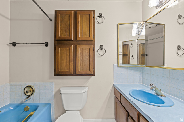 320 North 150 West Logan, UT 84321 - Photo 9 of 22 Full bath with tasteful backsplash, a garden tub, and vanity
