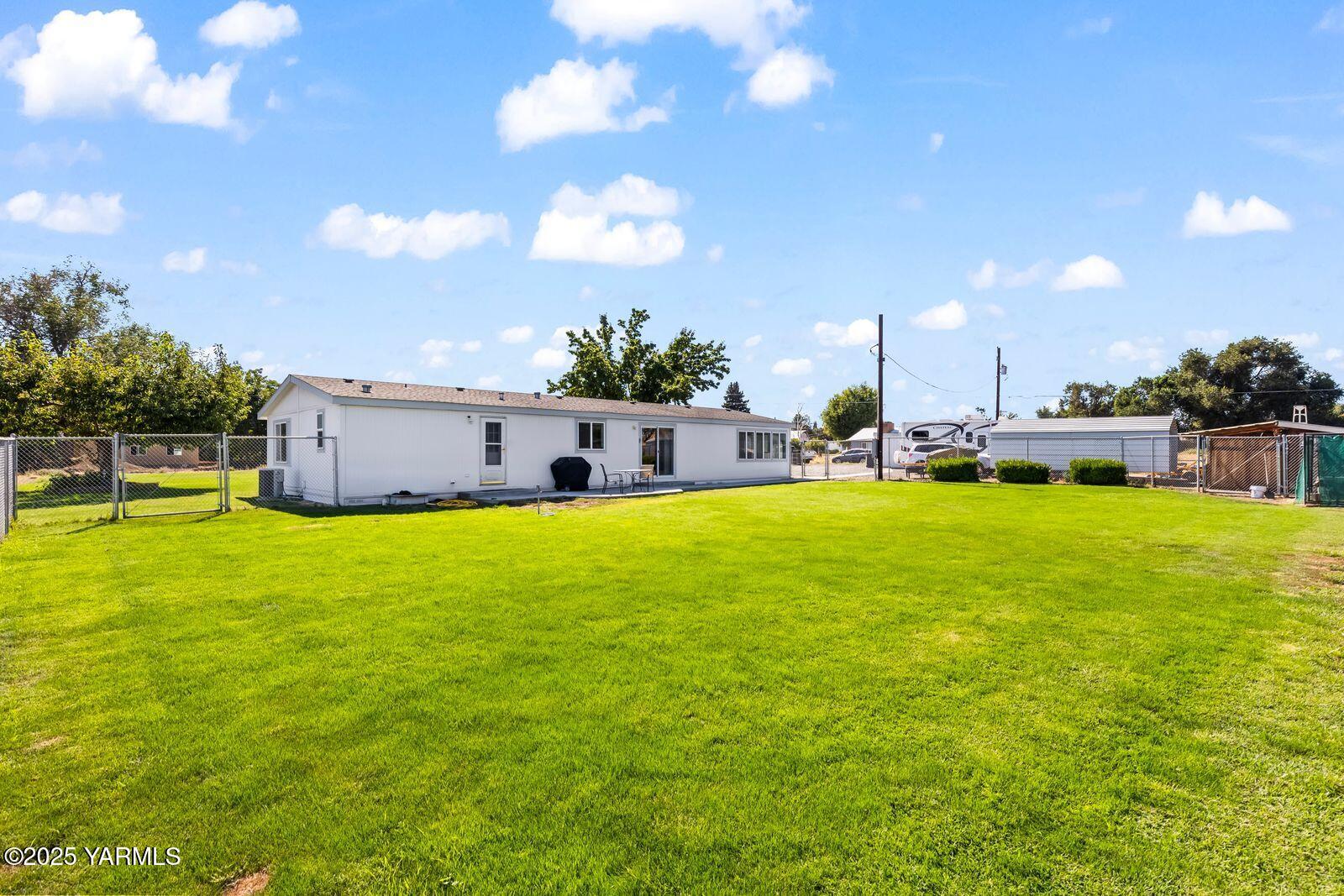 7907 Ahtanum Road Yakima, WA 98903 - Photo 14 of 21 a swimming pool with yard and outdoor seating