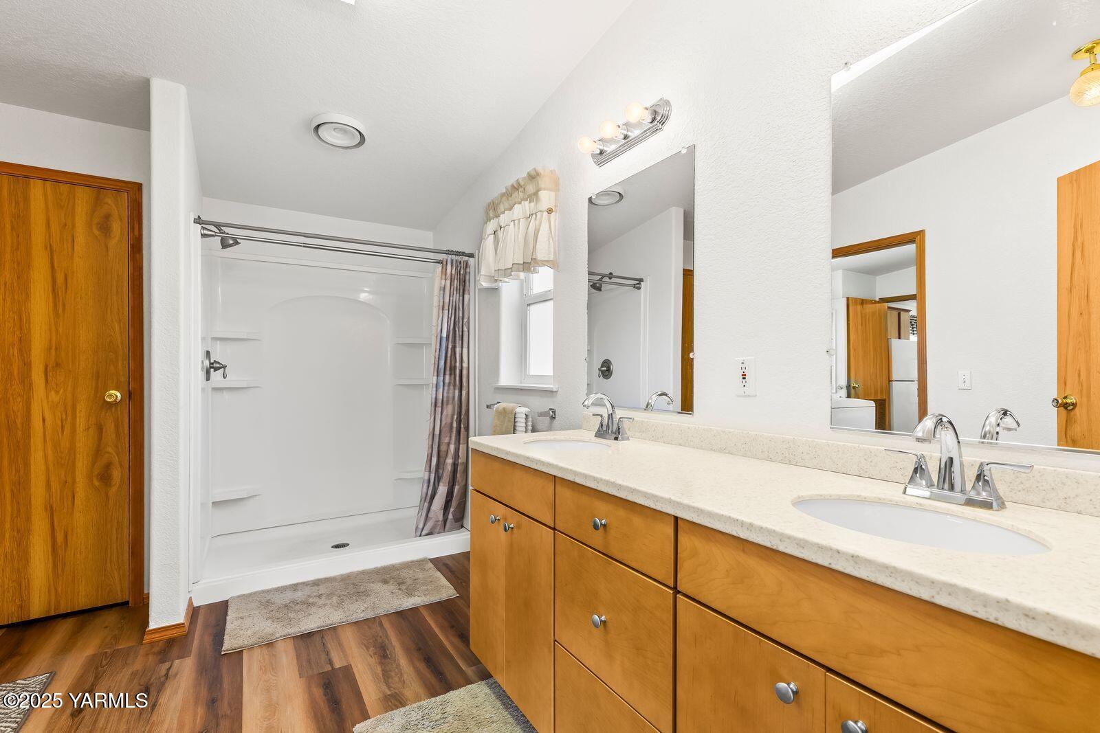 7907 Ahtanum Road Yakima, WA 98903 - Photo 20 of 21 a bathroom with a sink a mirror and a shower
