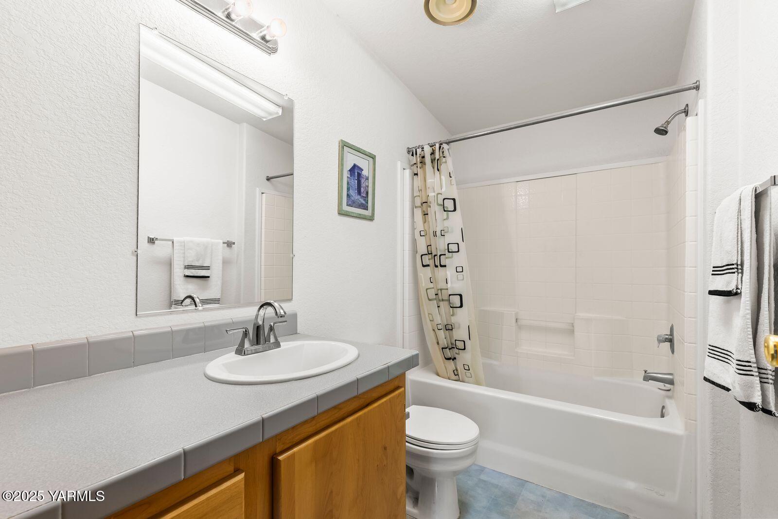 7907 Ahtanum Road Yakima, WA 98903 - Photo 4 of 21 a bathroom with a sink a toilet and shower