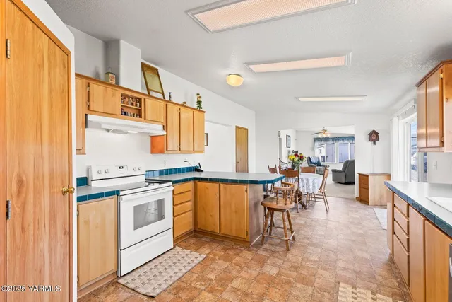 a view of a kitchen and dining area