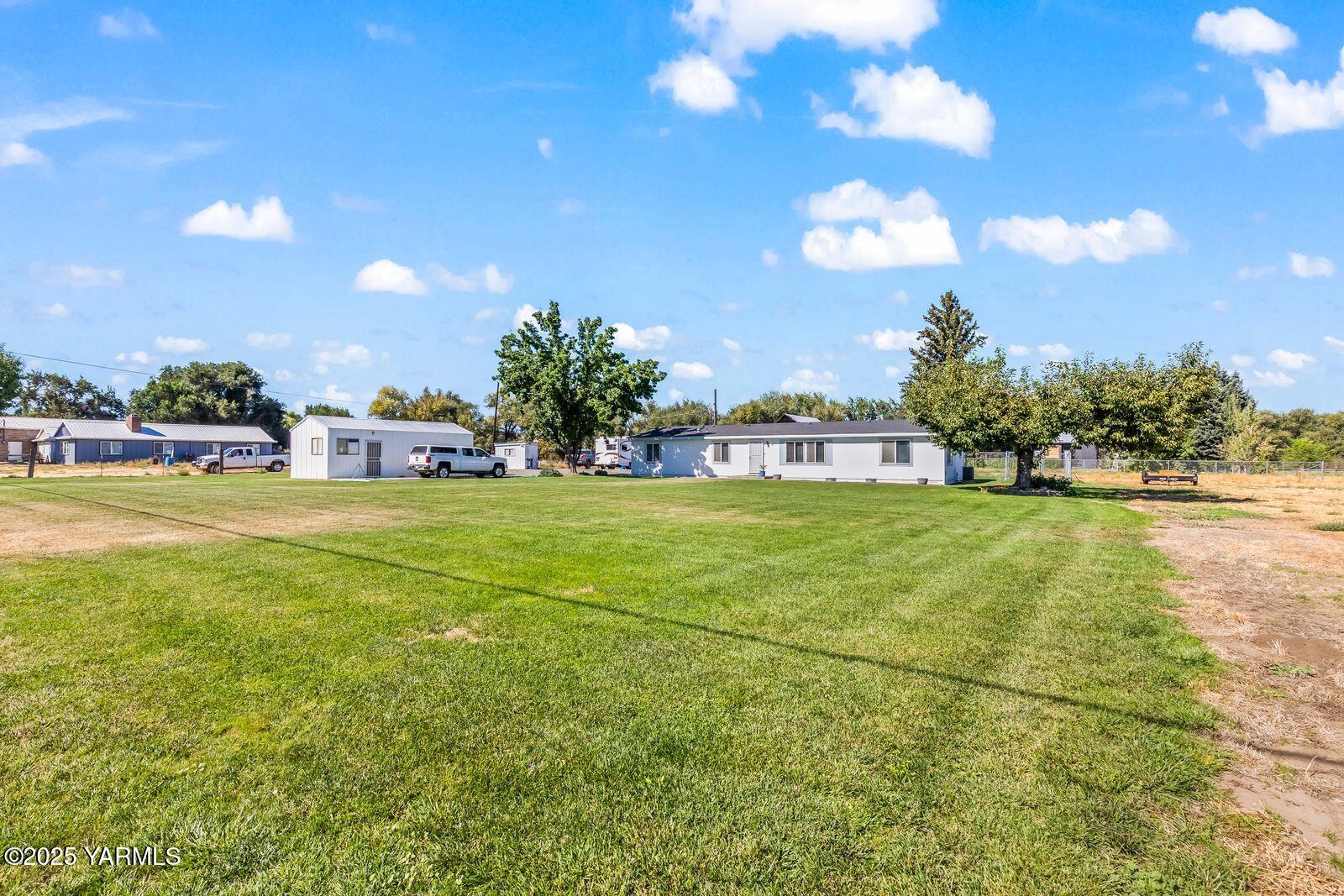 7907 Ahtanum Road Yakima, WA 98903 - Photo 6 of 21 a view of yard with swimming pool and green space
