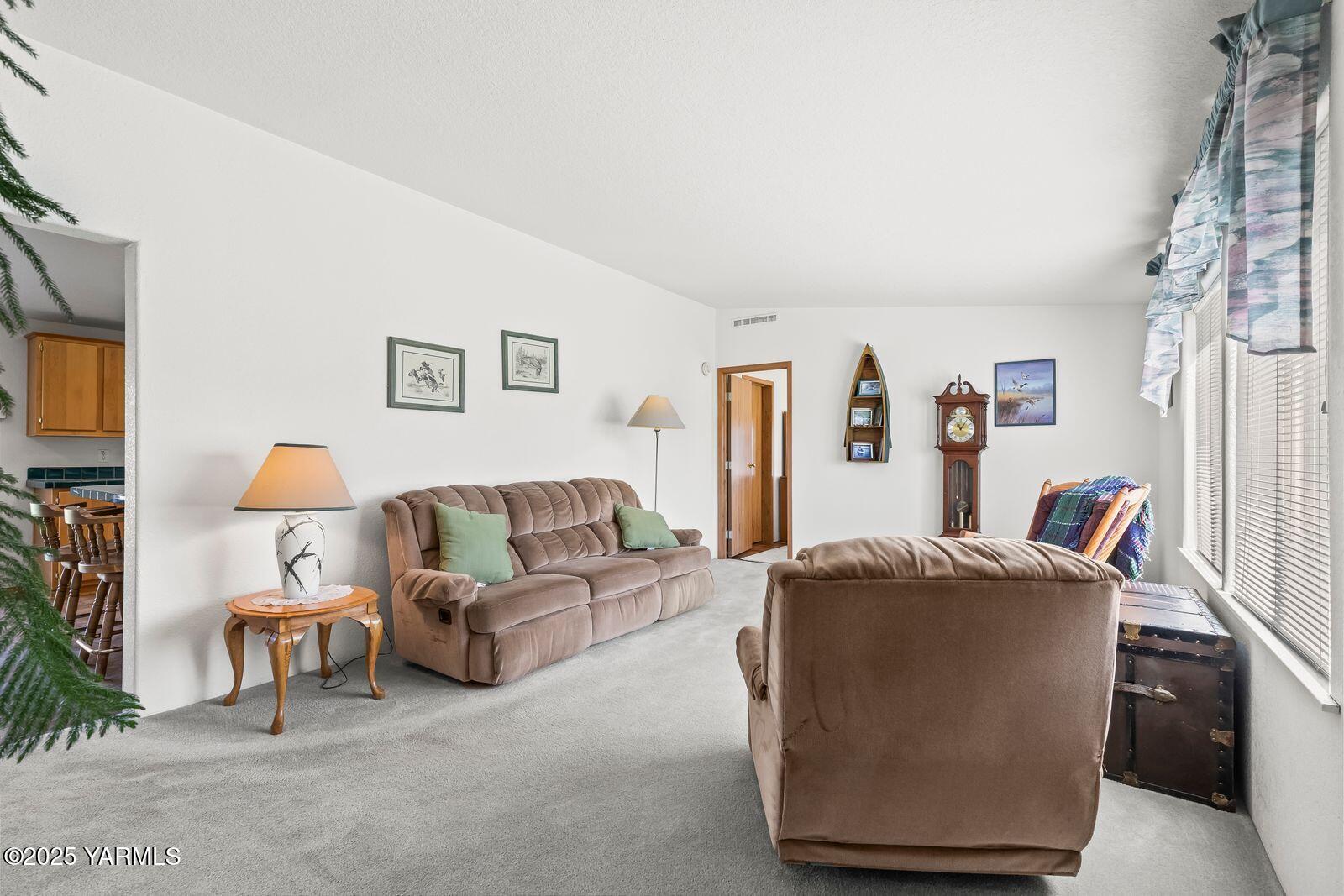 7907 Ahtanum Road Yakima, WA 98903 - Photo 7 of 21 a living room with furniture a couch and a flat screen tv