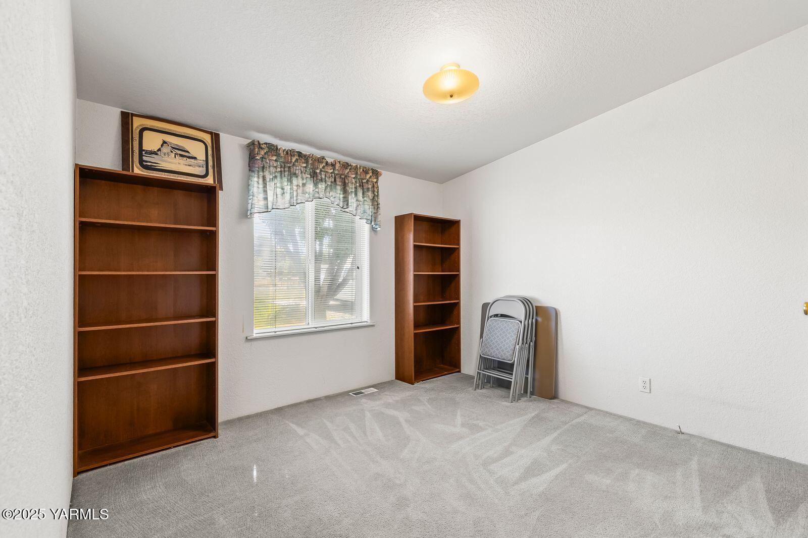 7907 Ahtanum Road Yakima, WA 98903 - Photo 10 of 21 a view of a livingroom with furniture and closet