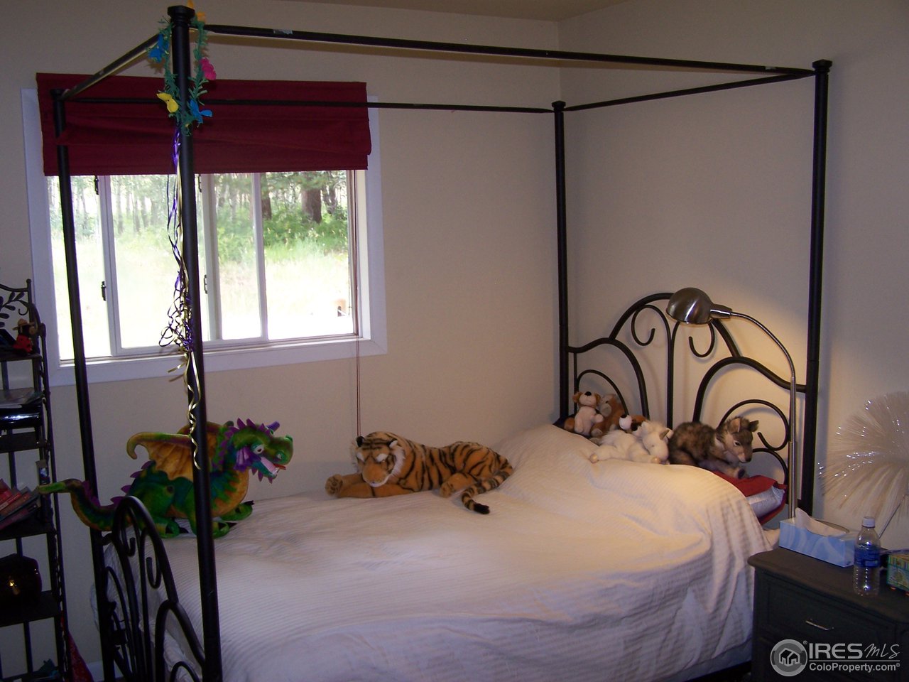 58 Old Post Office Road Boulder, CO 80302 - Photo 6 of 16 a bedroom with a bed and a table