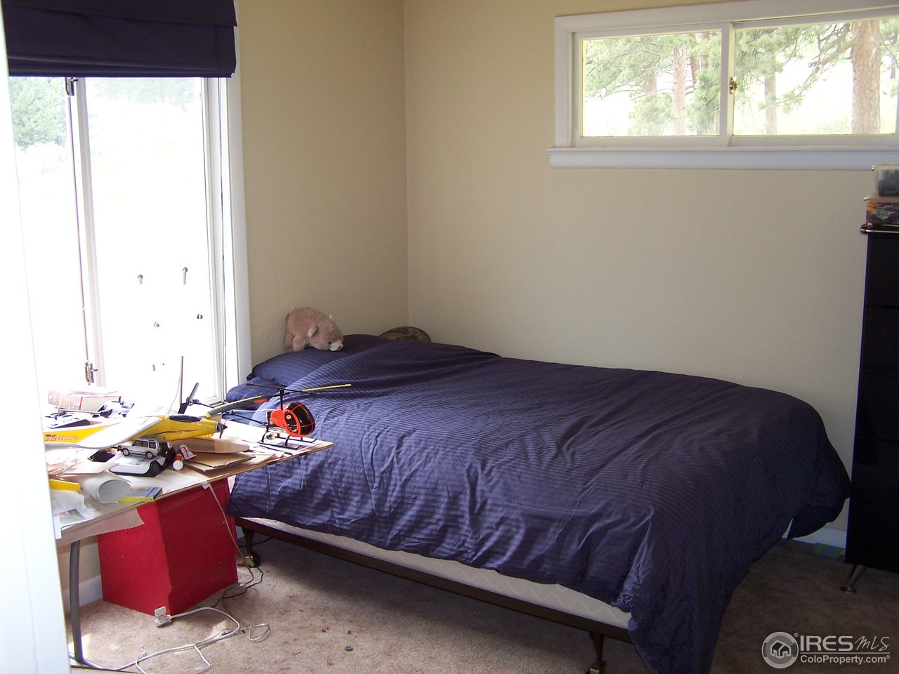 58 Old Post Office Road Boulder, CO 80302 - Photo 8 of 16 a bedroom with a bed and a window
