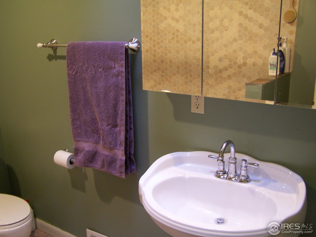 58 Old Post Office Road Boulder, CO 80302 - Photo 10 of 16 a bathroom with a sink and mirror with toilet