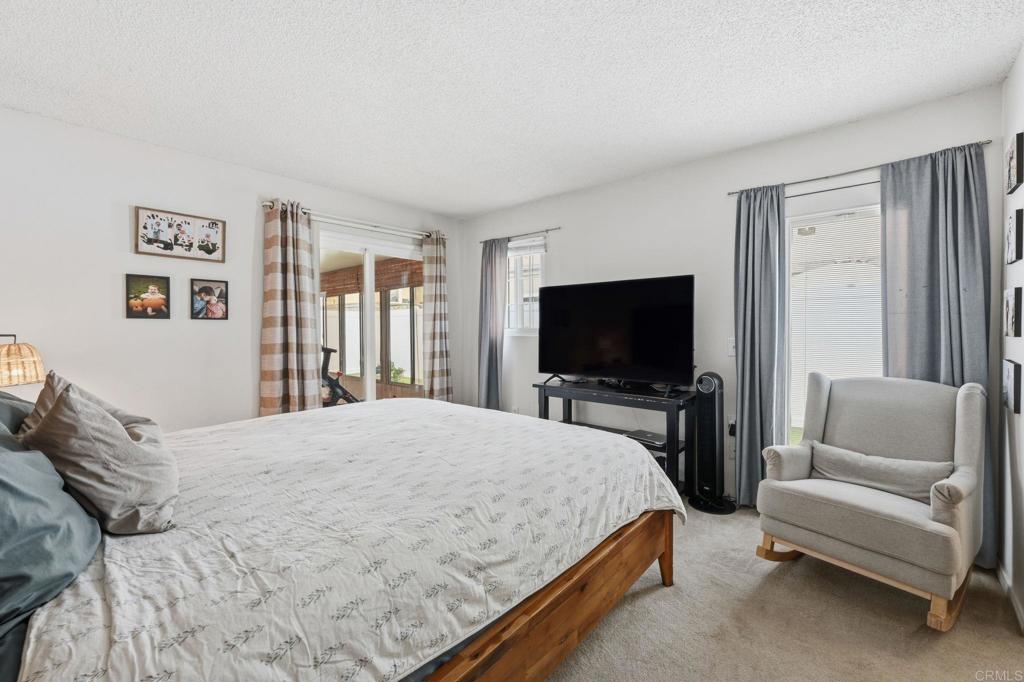 270 Chestnut Way Oceanside, CA 92057 - Photo 13 of 43 a bedroom with a bed and a flat screen tv