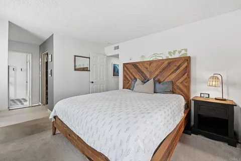 a bedroom with a bed and a closet