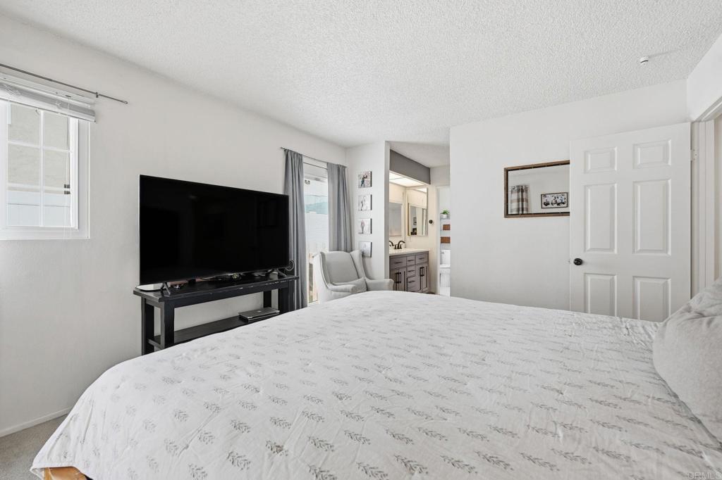 270 Chestnut Way Oceanside, CA 92057 - Photo 15 of 43 a bedroom with a bed and a flat screen tv
